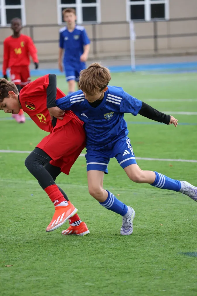 Soccer coach with young athletes